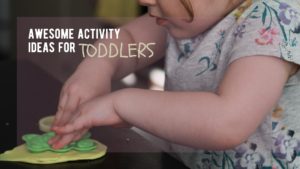 pushes mold with both hands into playdoh as one of many home activities for toddlers