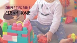 toddler sits in mess of toys