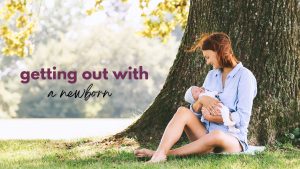 A mother sits on the ground under a large tree holding her newborn baby with the text "getting out with a newborn"