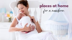 A new mom sits in a rocking chair in a nursery with her newborn baby sleeping on her chest
